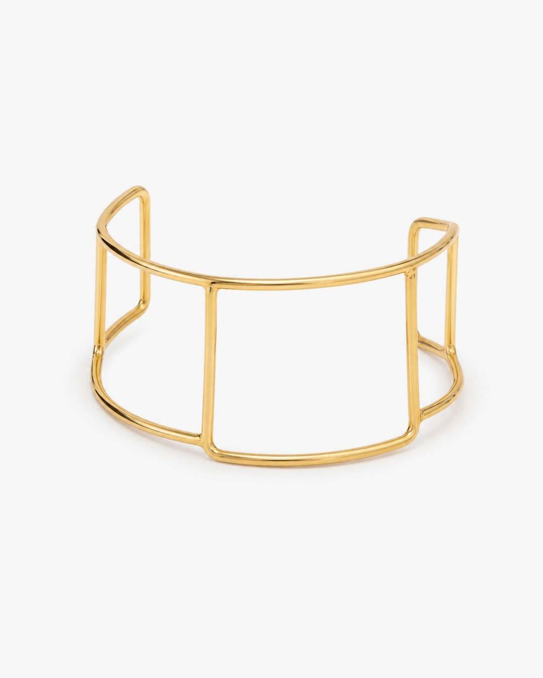 A gold-toned open wire cuff bracelet with a geometric, cage-like design, displayed on a clean white background.