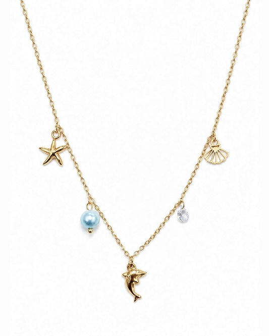 A gold chain necklace featuring sea-themed charms, including a starfish, seashell, dolphin, and a light blue pearl bead, shown on a plain white background.