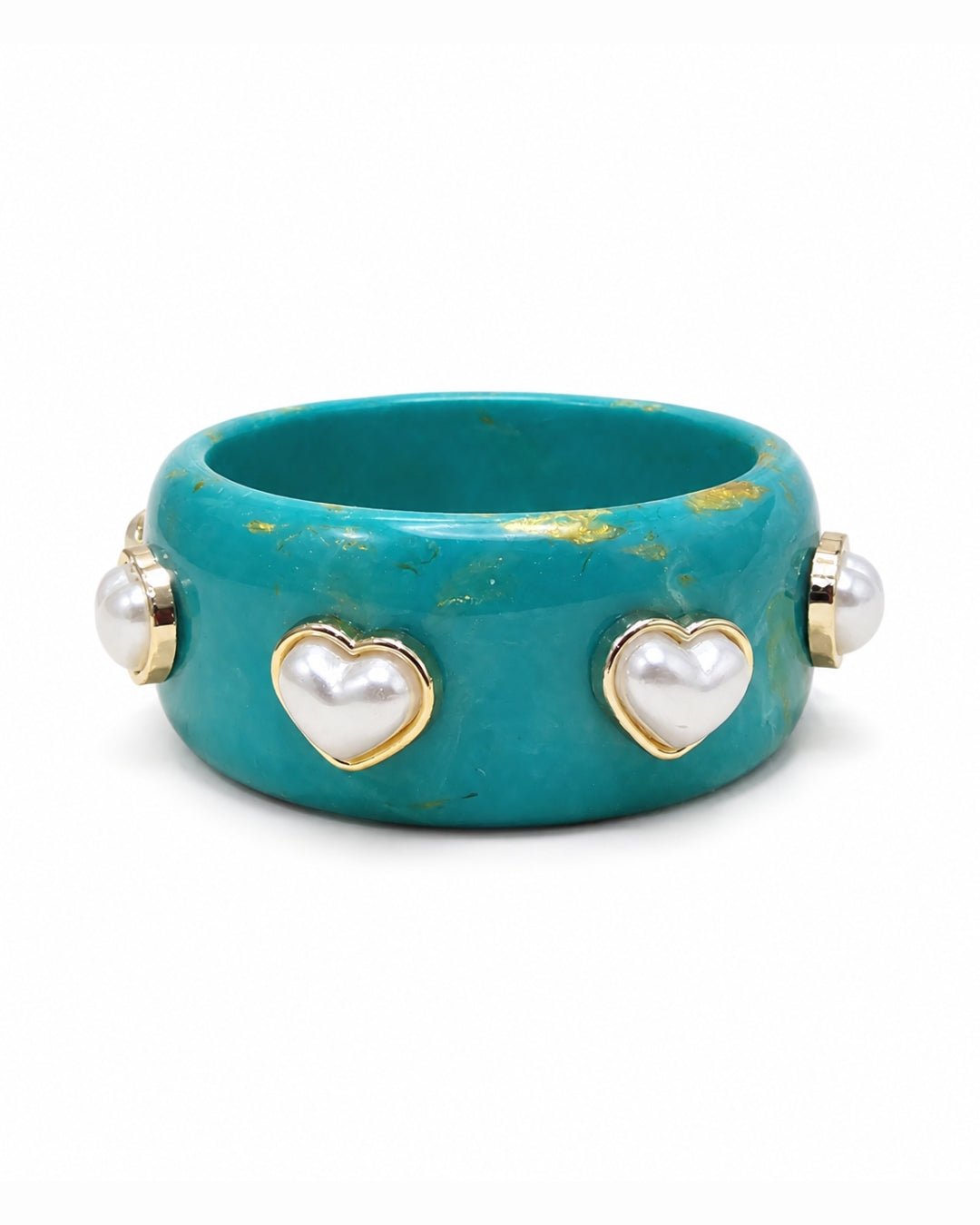 A wide turquoise bangle bracelet featuring three gold heart charms with white faux pearls on the front, flanked by two smaller pearl and gold side details, set against a plain white background.