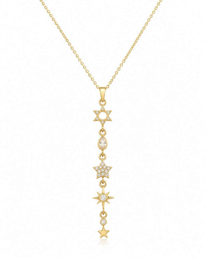A gold lariat-style pendant necklace featuring a vertical line of star and moon motifs, some adorned with small clear stones, shown on a plain white background.
