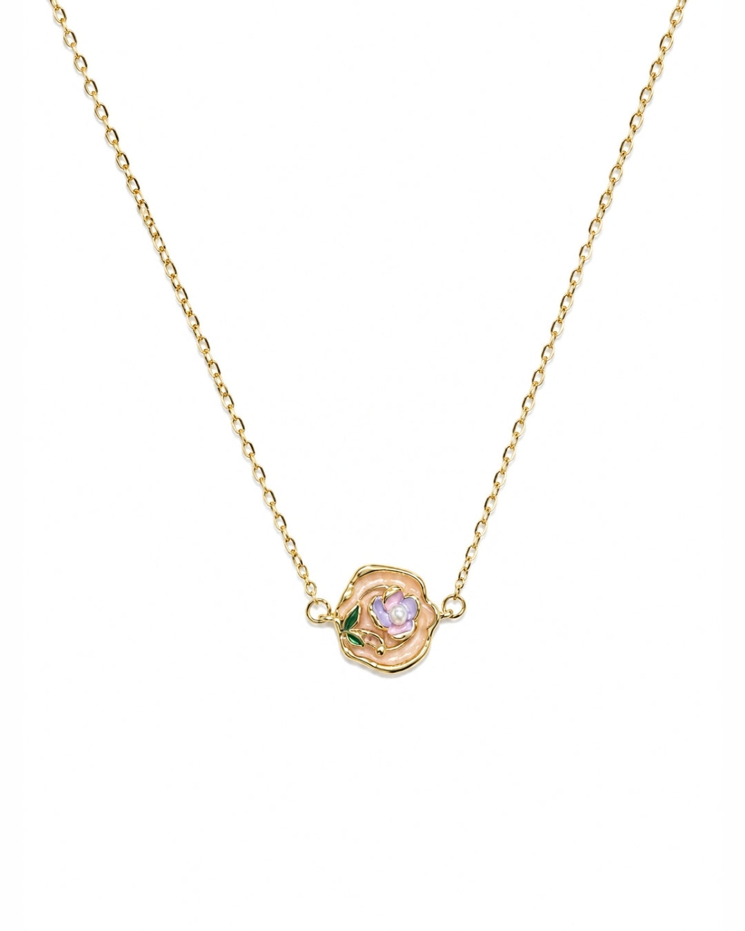 A delicate gold chain necklace featuring a small rose-shaped pendant with a light purple center and tiny green leaf accents, shown against a plain white background.