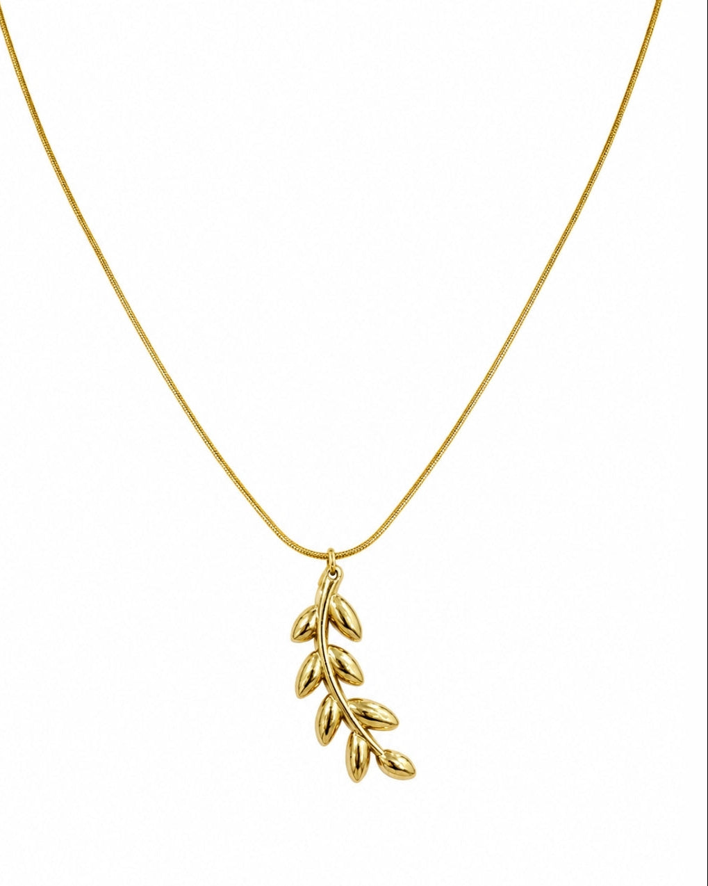 A delicate gold chain necklace featuring a small leafy branch pendant, shown against a plain white background.