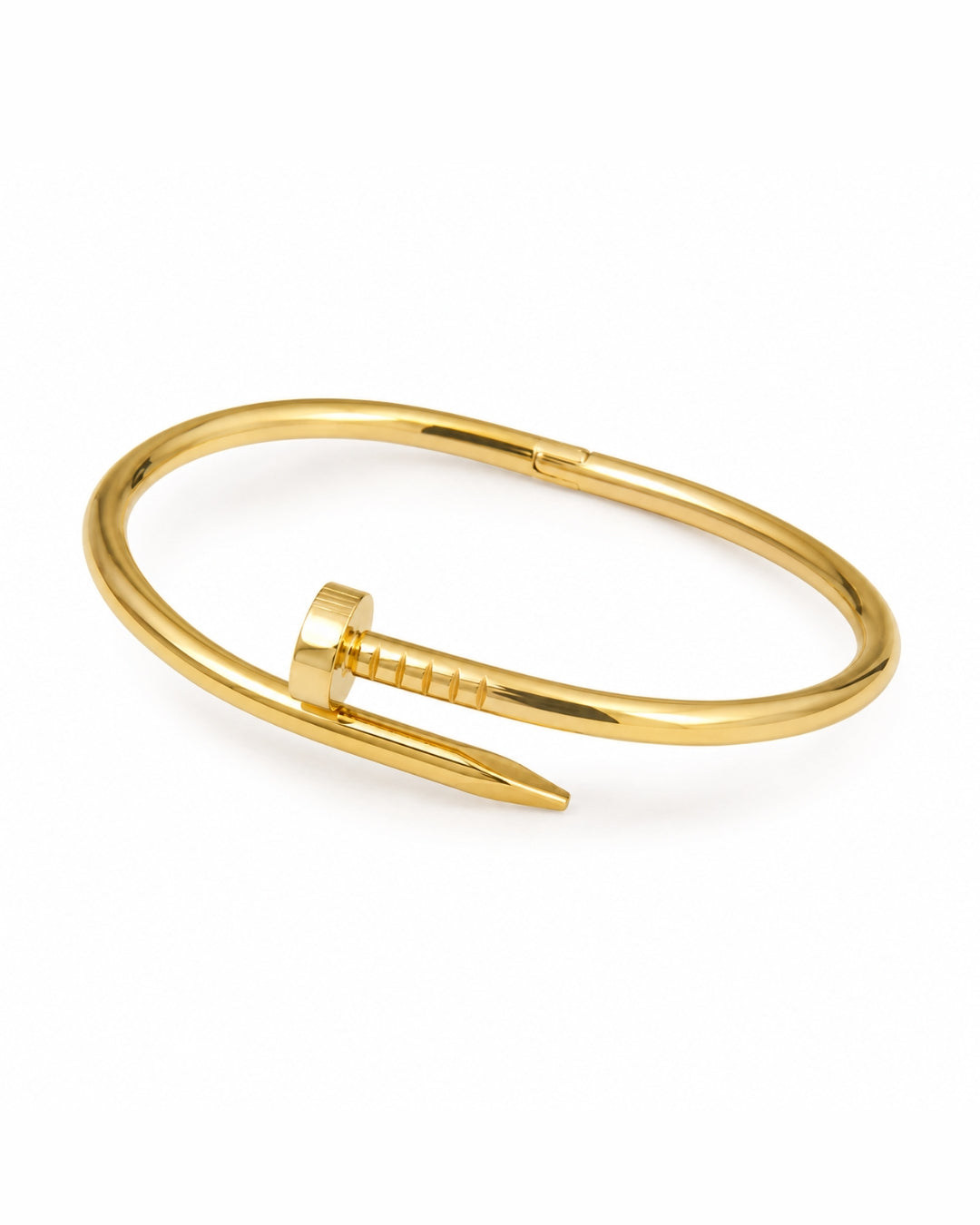 A gold-toned metal cuff bracelet designed like a barbed nail, shown on a clean white background.