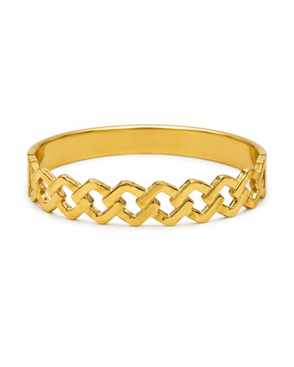 A polished gold bangle bracelet featuring a continuous interlocking geometric link pattern, shown on a clean white background.