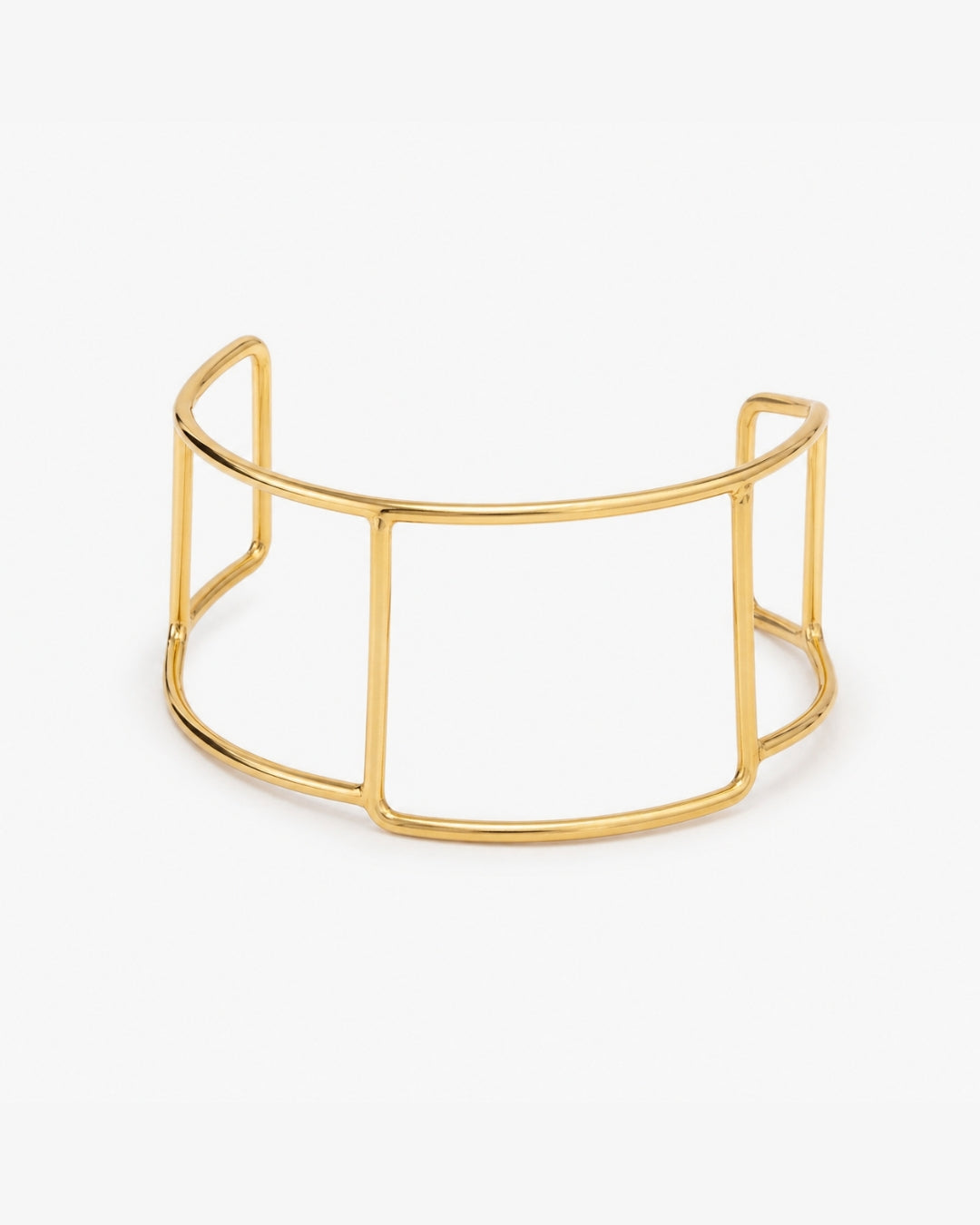 A gold-toned open wire cuff bracelet with a geometric, cage-like design, displayed on a clean white background.