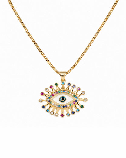 Gold chain necklace with an evil eye pendant featuring multicolored gemstone accents on a white background.