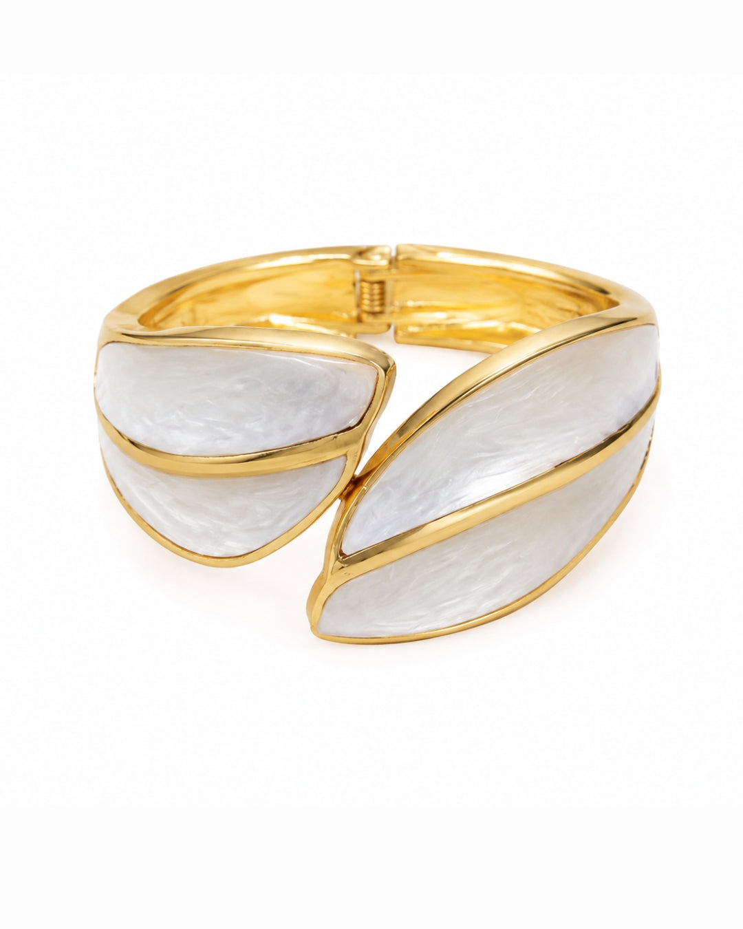 A gold and white enamel cuff bracelet with a split leaf design, shown on a clean white background.