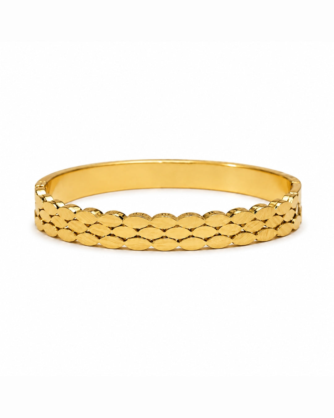 A gold bangle bracelet with a textured, overlapping scale-like pattern on the outer band, shown against a plain white background.
