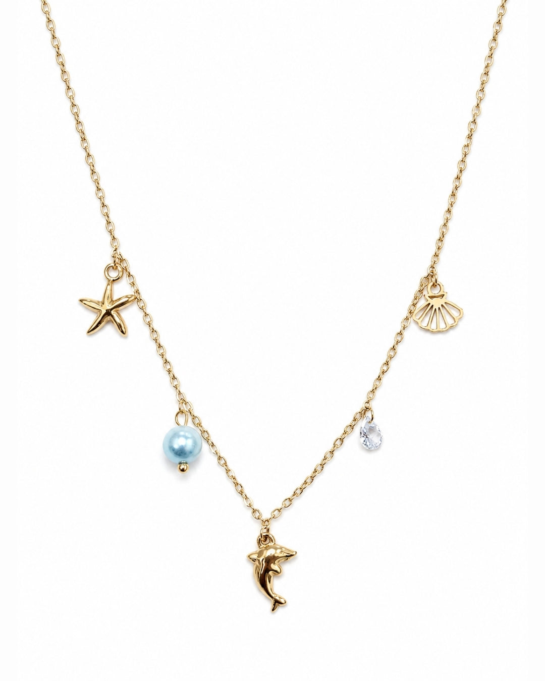 A gold chain necklace featuring sea-themed charms, including a starfish, seashell, dolphin, and a light blue pearl bead, shown on a plain white background.