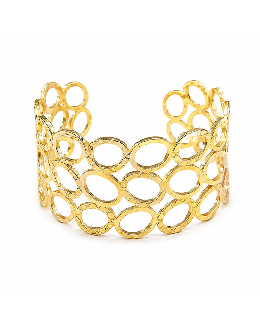 A gold open-link cuff bracelet with a textured, hammered finish, displayed on a clean white background.