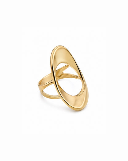 A polished gold ring with a large, open, abstract oval design, photographed on a clean white background.