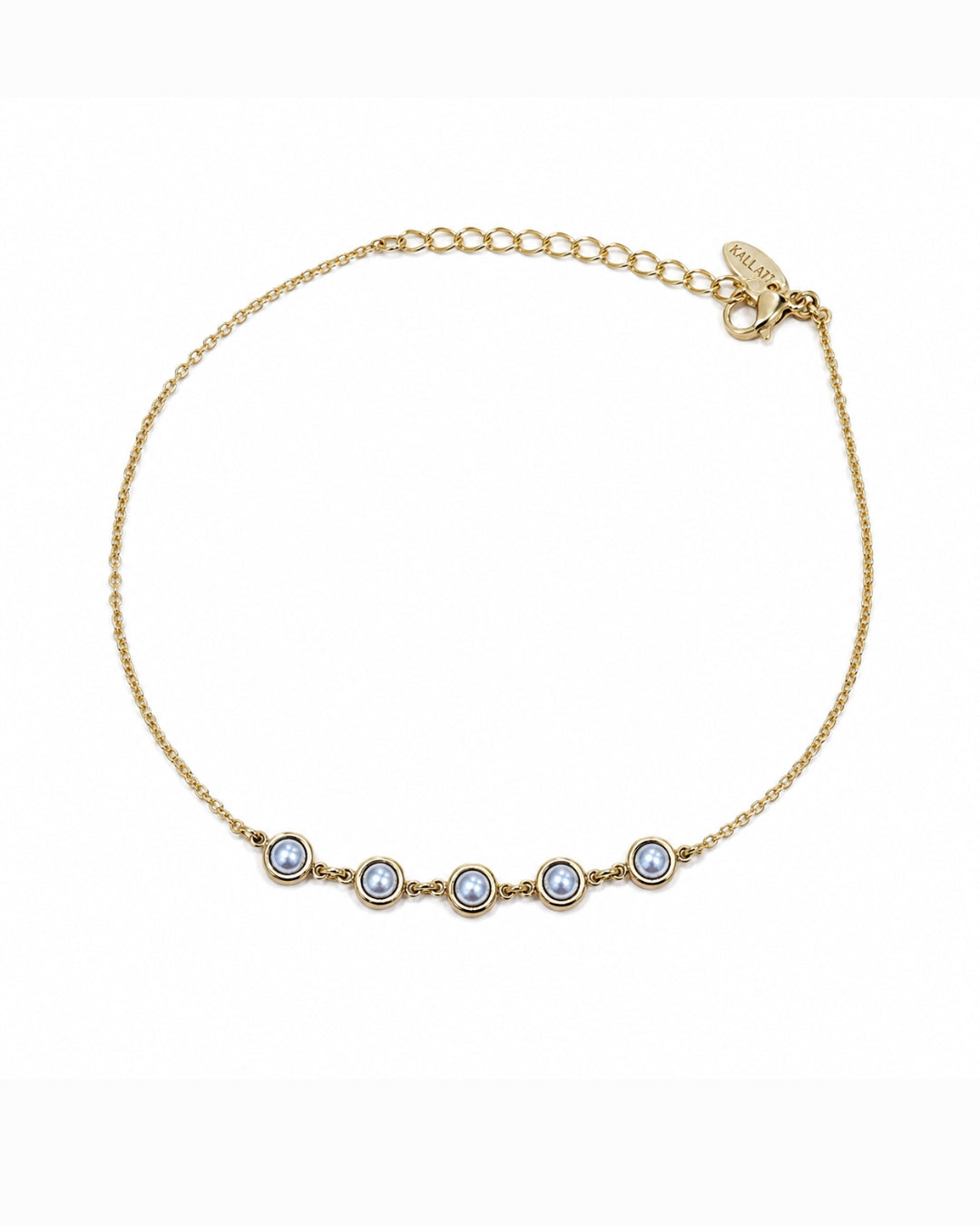 A delicate gold chain anklet featuring five small round bezel-set light blue gemstones in a row, displayed on a clean white background.