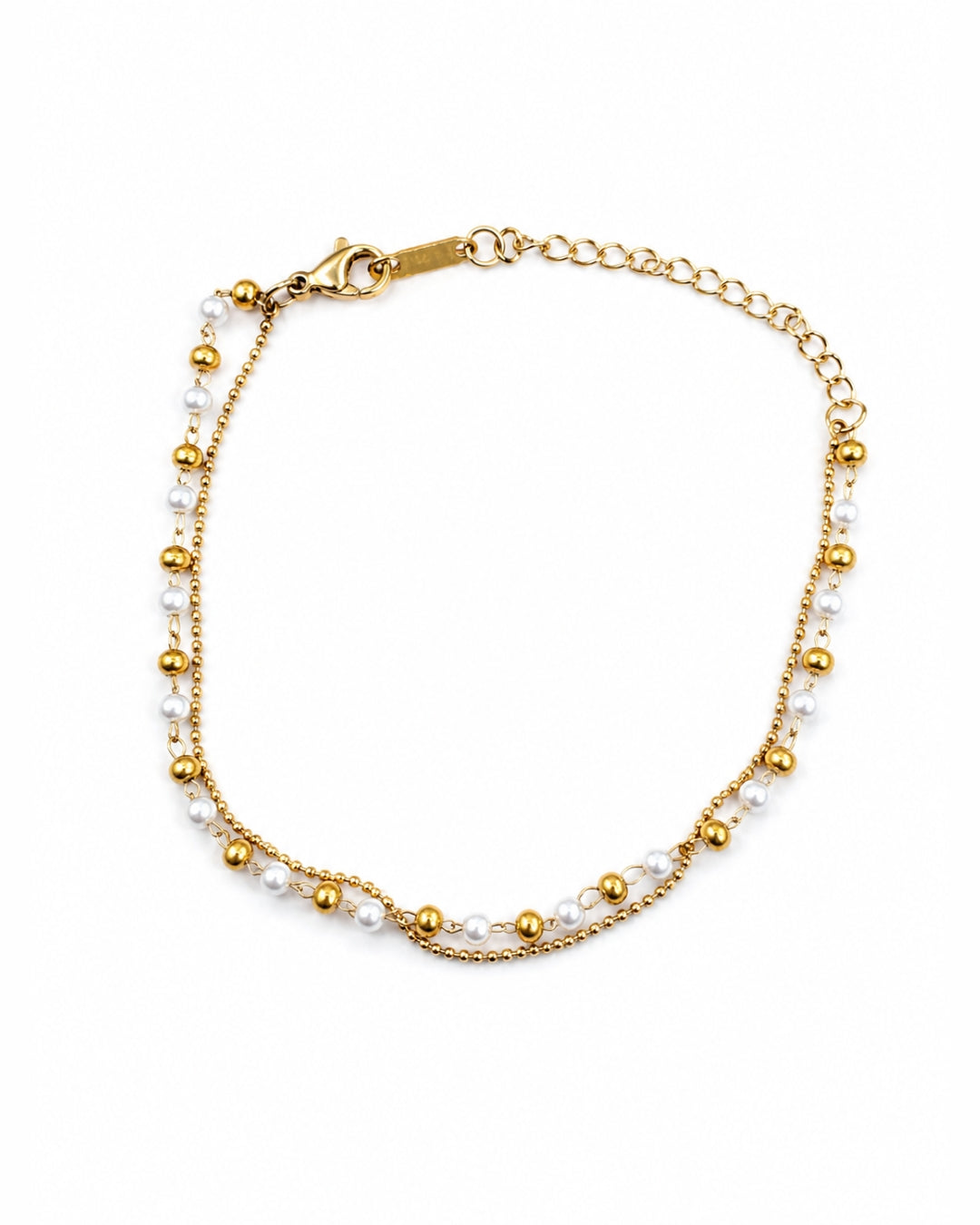 A delicate gold chain bracelet featuring small white pearls and polished gold beads, displayed on a clean white background.