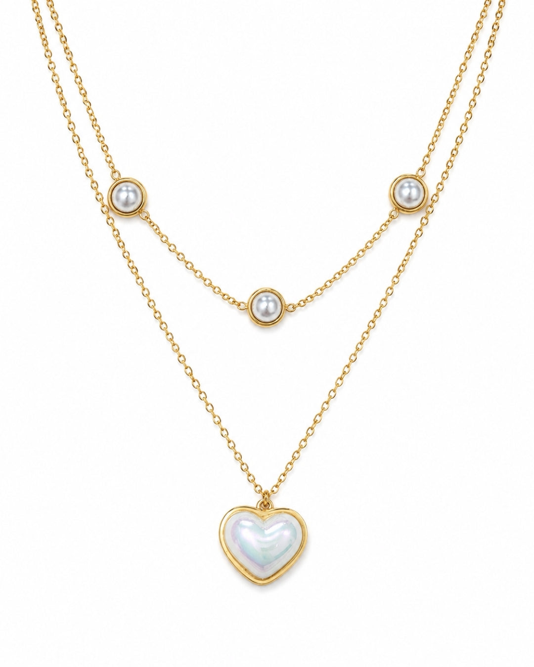 A double-layered gold necklace featuring a long chain with a heart-shaped iridescent pearl pendant and a shorter chain with three small round pearl beads, displayed on a clean white background.