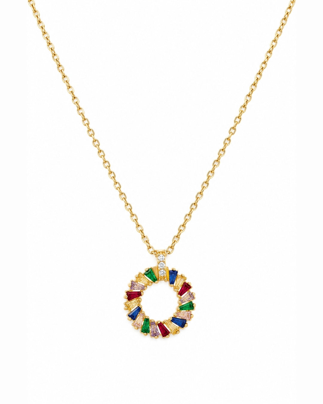A gold chain necklace with a circular pendant featuring colorful, faceted gemstone segments in red, green, blue, purple, and clear stones, set against a plain white background.