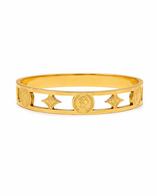 A gold bangle bracelet featuring openwork cutouts with embossed circular medallions and star motifs, displayed on a clean white background.