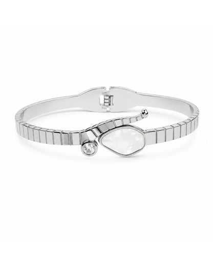 A silver-toned bangle bracelet featuring a segmented, ribbed design, a large irregular teardrop-shaped clear stone, and a small round clear accent stone, shown on a plain white background.