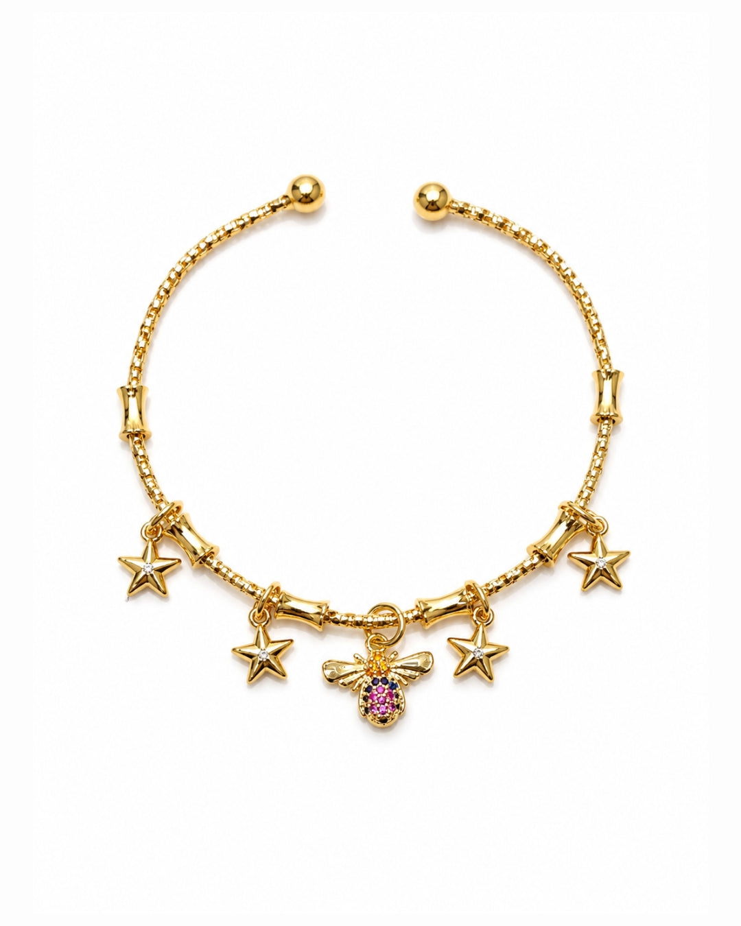 A gold-plated charm bracelet featuring five star charms and a central bee charm embellished with a pink gemstone, displayed on a clean white background.