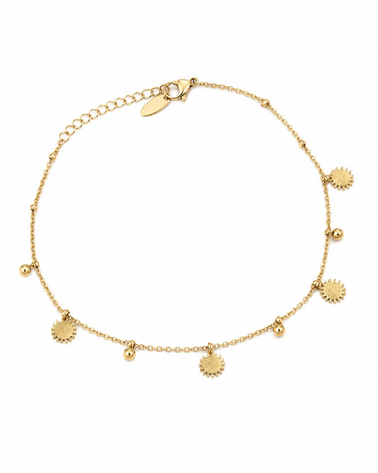 A delicate gold chain anklet featuring small sunburst charms and tiny gold beads, displayed on a clean white background.