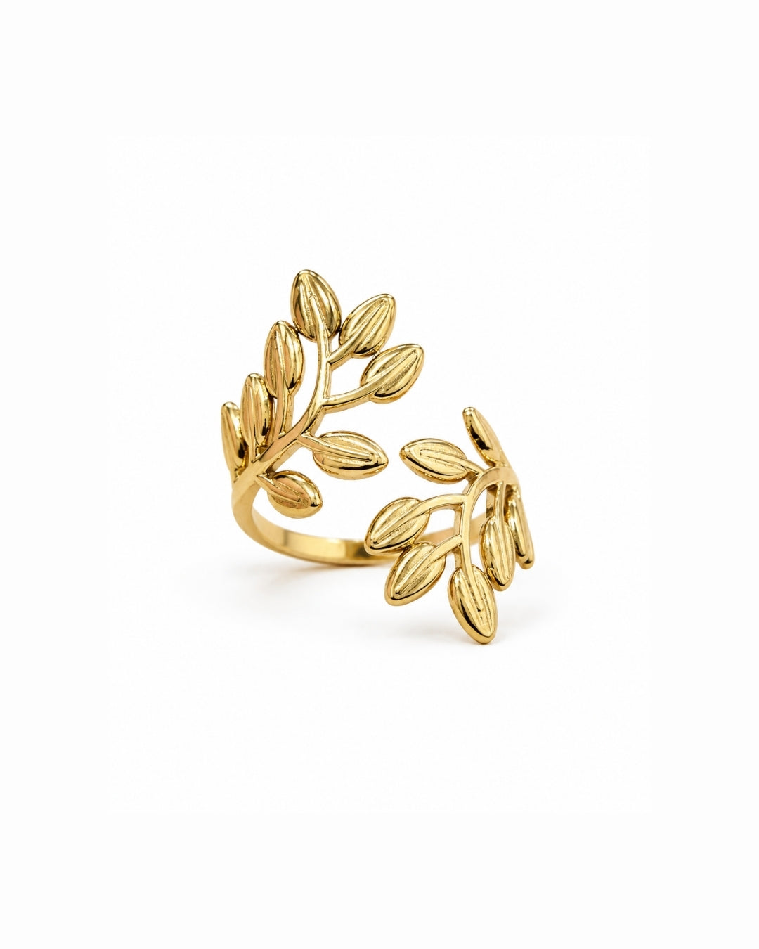 A gold leaf branch wrap ring on a clean white background.