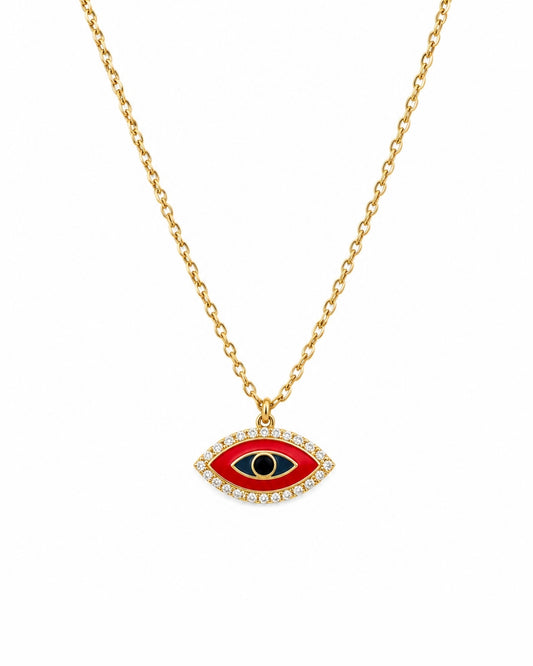 Gold chain necklace with an evil eye pendant featuring a red enamel background, a black pupil, and a border of small clear crystals on a white background.